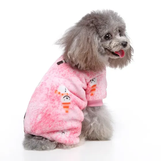 A gray poodle sitting and modeling a pink fleece dog sweater with snowman designs.