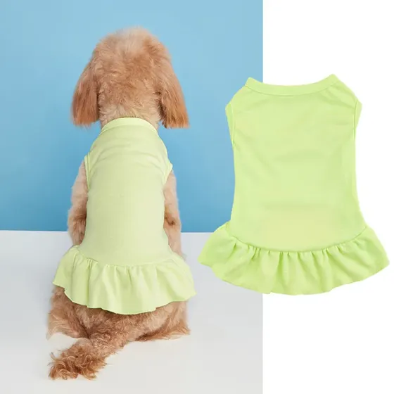 Rear view of a brown poodle wearing a lime green dress with a ruffled hem, shown next to a flat lay of the same garment.