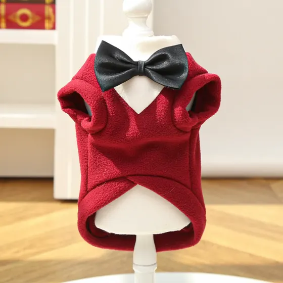 Red fleece pet vest with a black bow tie displayed on a white mannequin