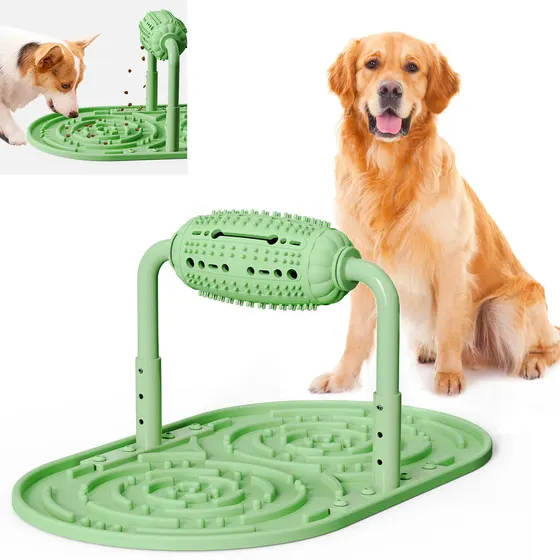 A green pet lick mat with an attached bone dispenser is displayed next to a golden retriever.