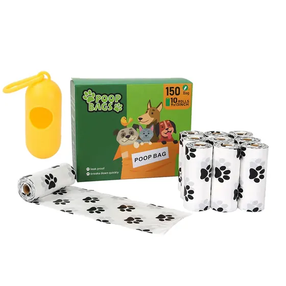Box of dog poop bags with paw prints, rolls, and a yellow dispenser on white background