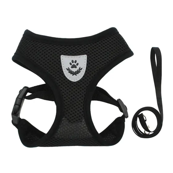 A black mesh dog harness with a grey paw print patch and a matching black leash.