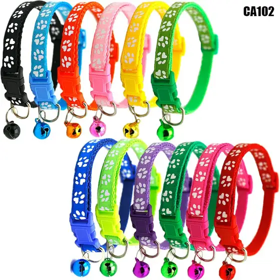 Collection of colorful silicone pet collars with paw prints and matching metal bells.