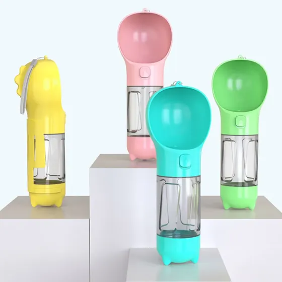Four colorful portable pet water bottles arranged on white pedestals
