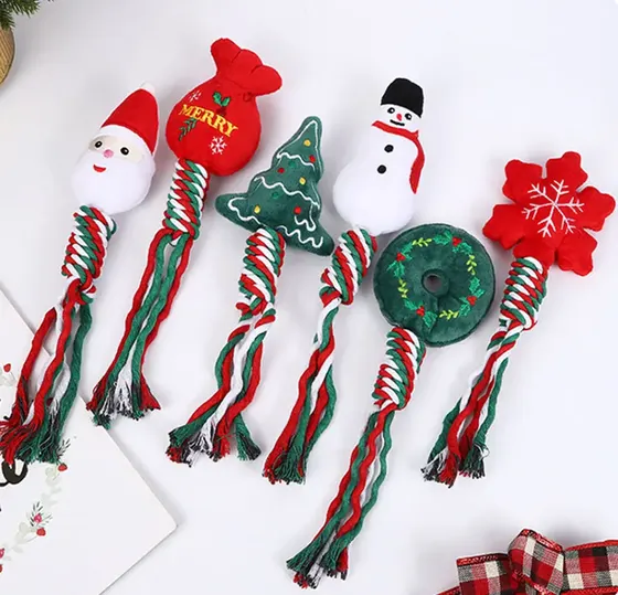 Six Christmas themed plush rope dog toys including Santa, snowman, and tree designs on a white background