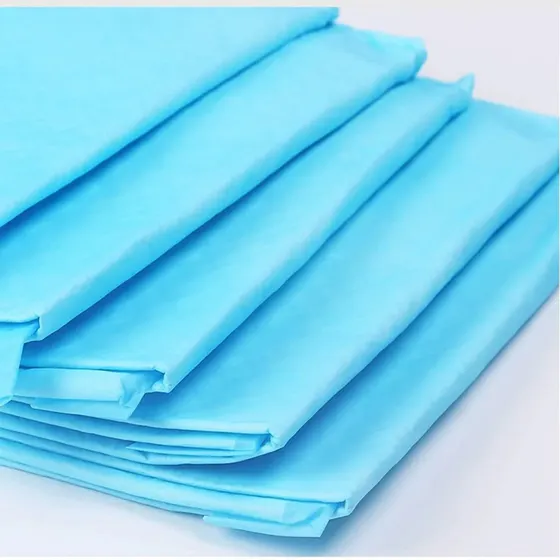 A stack of folded light blue industrial packaging bags on a white background.