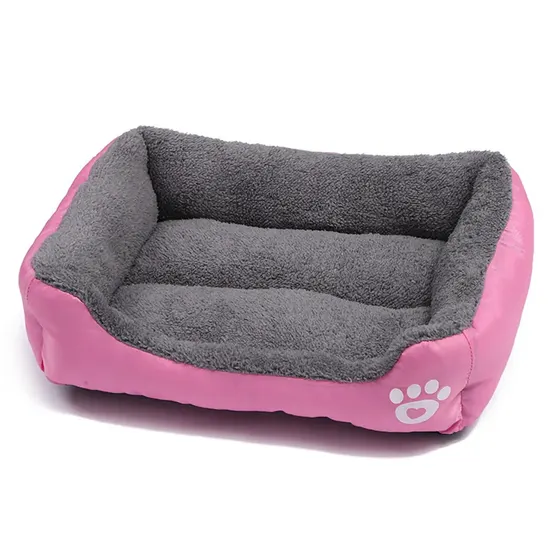Pink and grey rectangular pet bed with paw print design on side