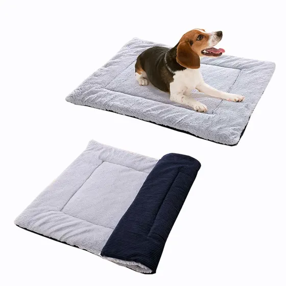 A beagle dog lying on a gray pet bed shown above a folded gray and navy reversible bed.
