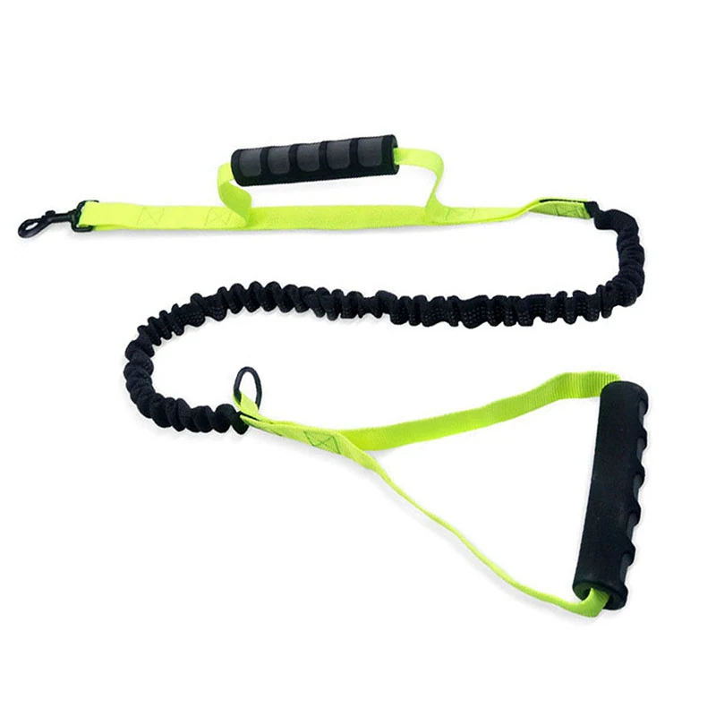 Neon yellow resistance band with black foam handles and a bungee cord section.