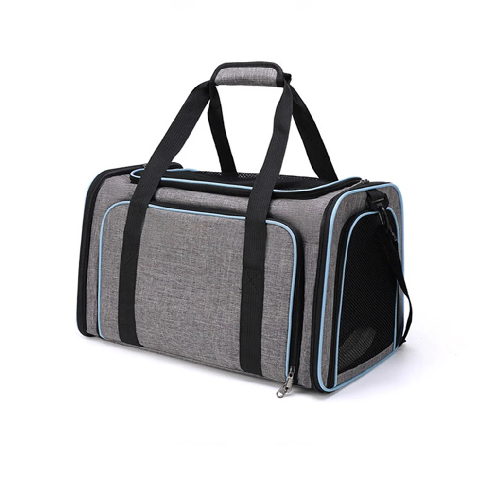 Grey fabric pet carrier bag with black straps and blue piping