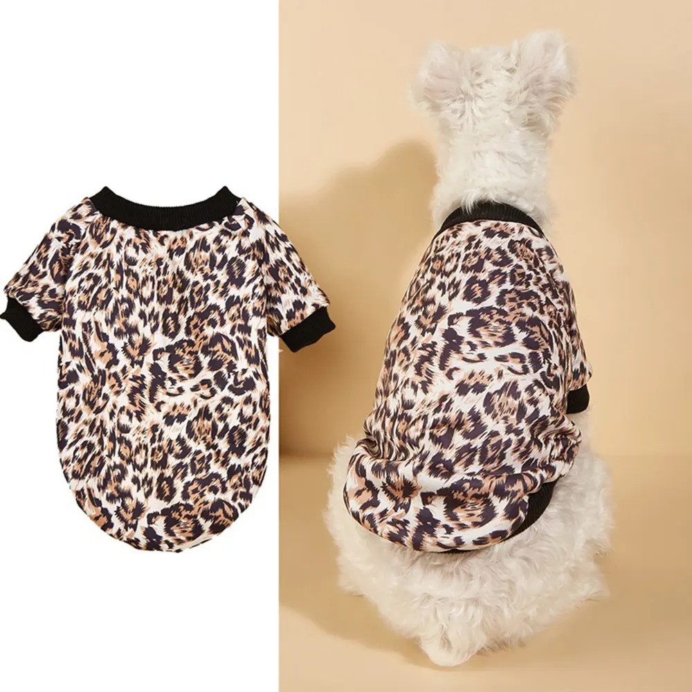 Leopard print pet shirt shown flat and worn by a white dog