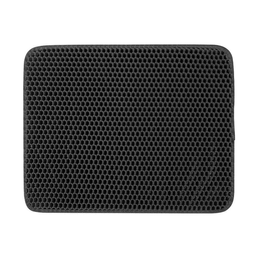 Black rectangular mat with textured honeycomb grid surface on a white background