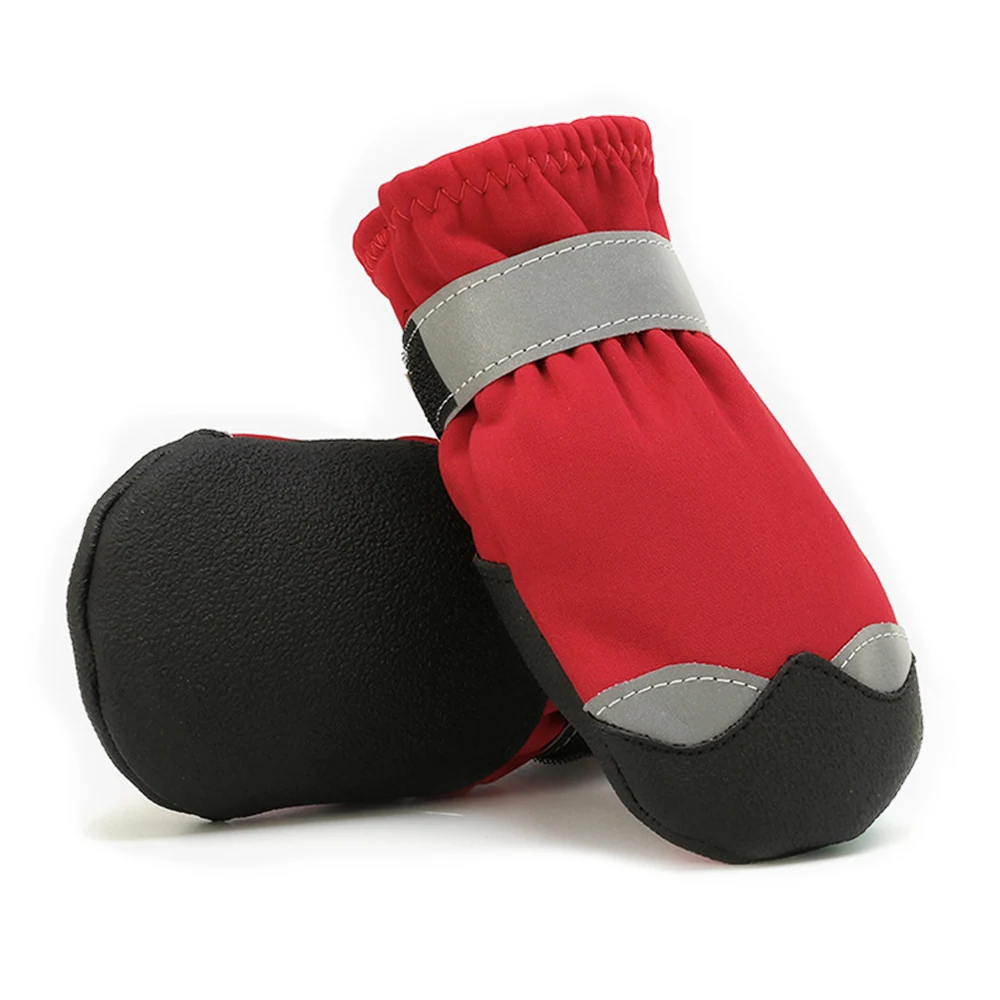 Pair of red and black protective booties with reflective grey strips on a white background.