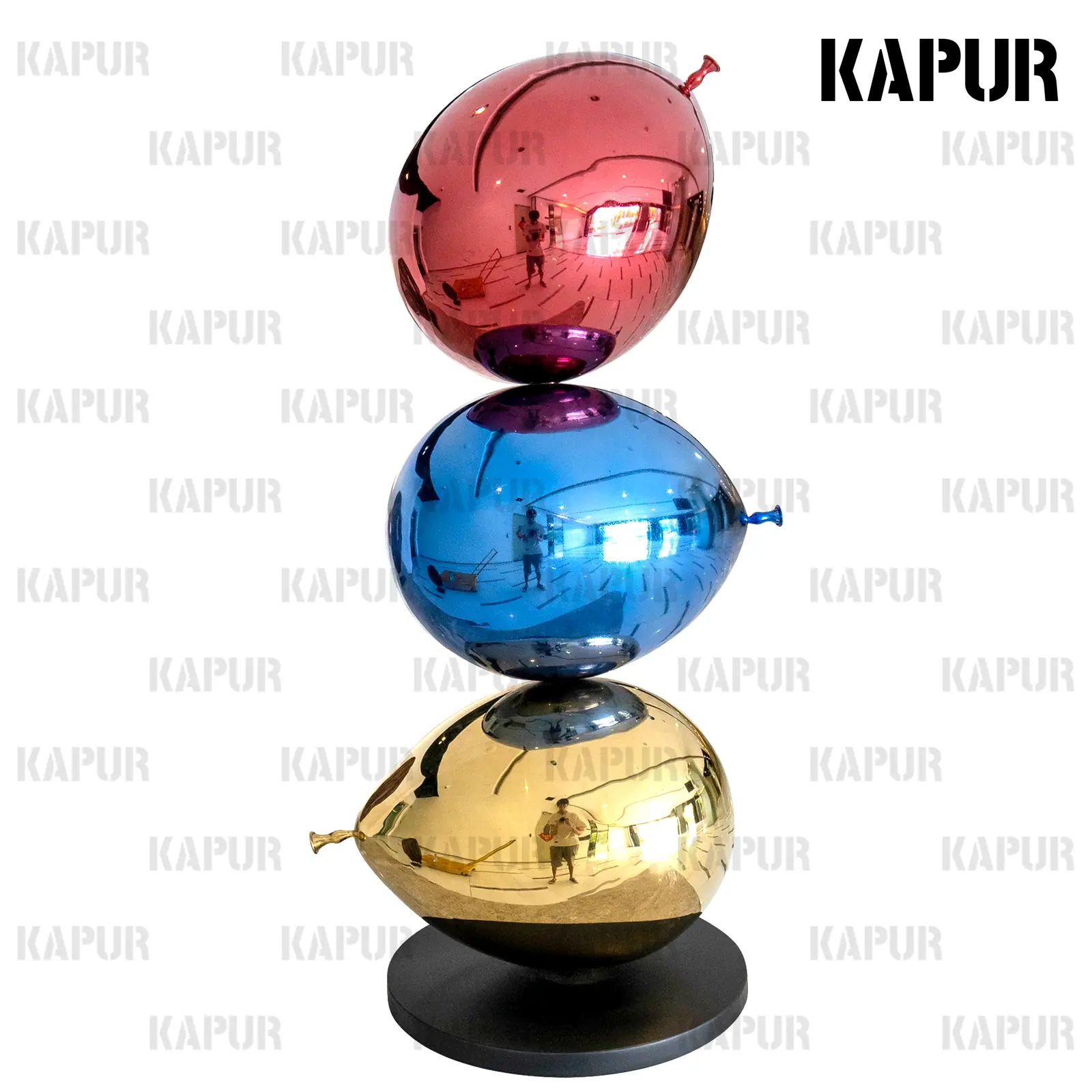 Polished 304 stainless steel tricolor balloon sculpture standing on a paved outdoor plaza