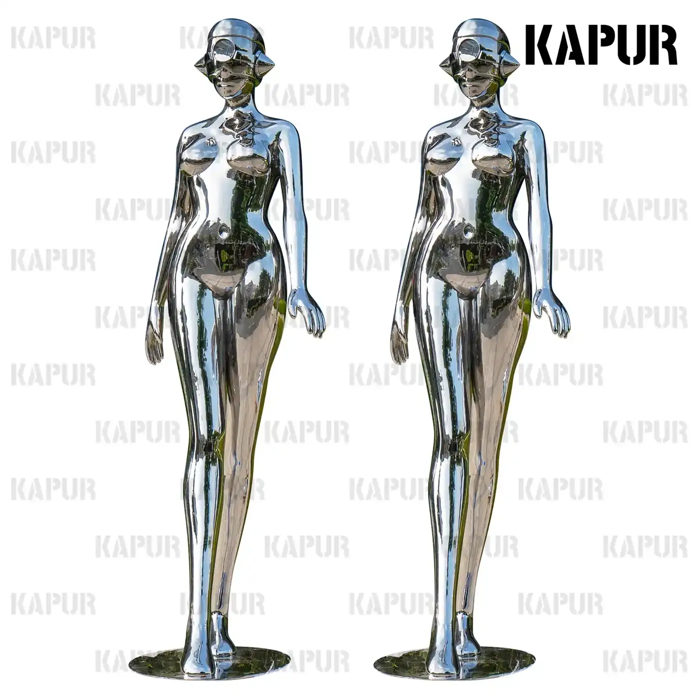 Abstract female figure sculpture in polished stainless steel standing in an outdoor plaza