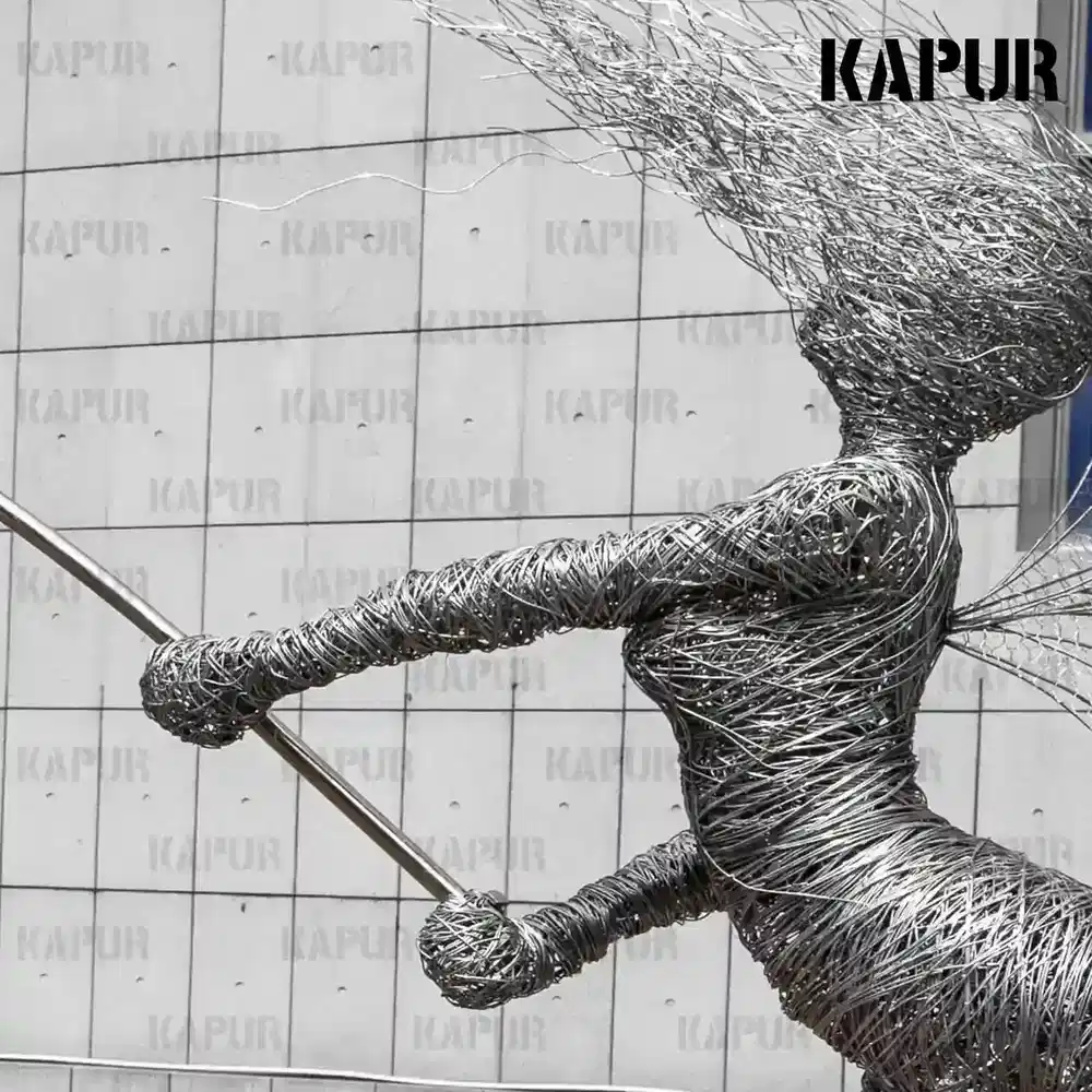 Second view of the Art Deco stainless steel fairy dandelion sculpture showing the curved, polished form from the side