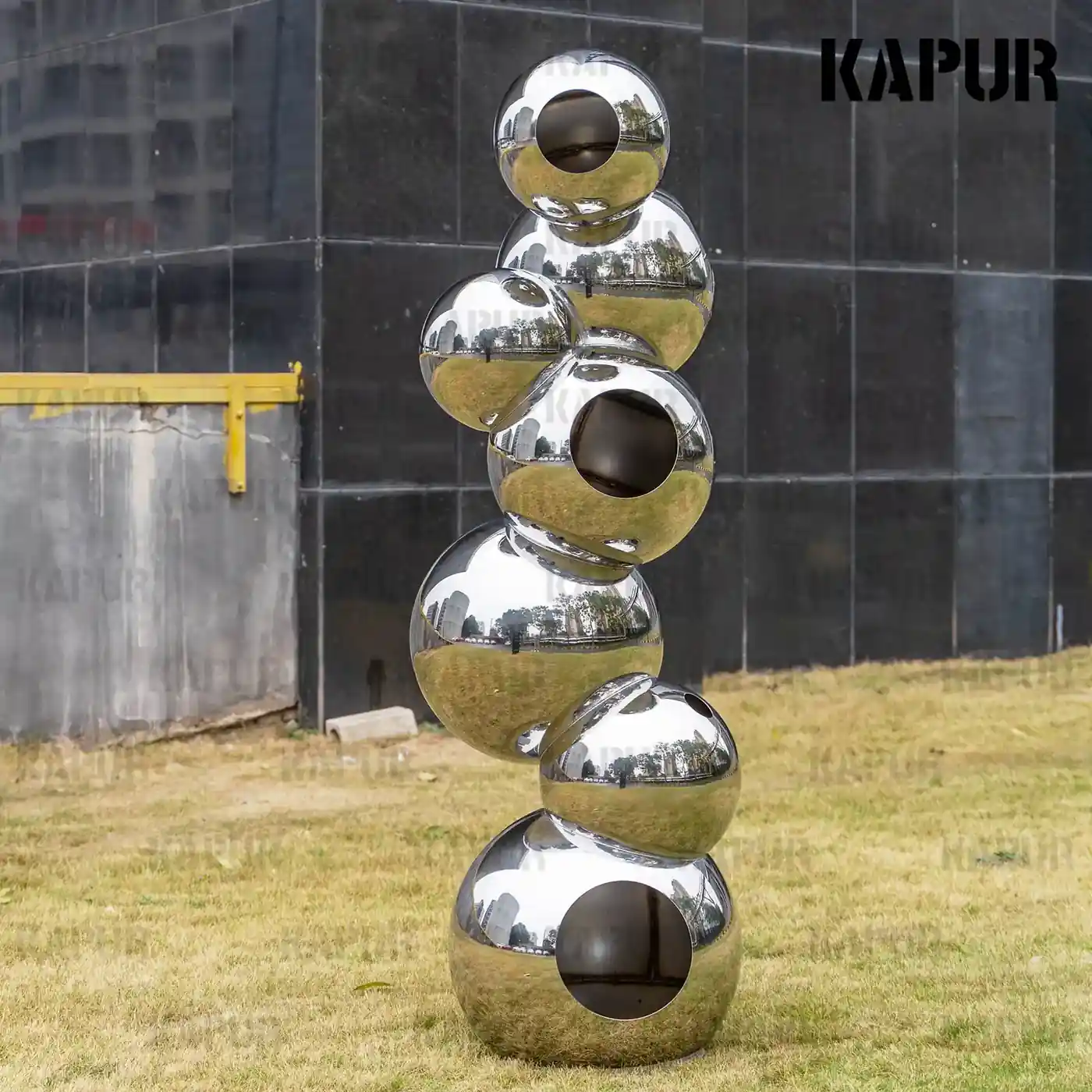 Second view of the stainless steel sphere showing the reflective surface and seamless welds