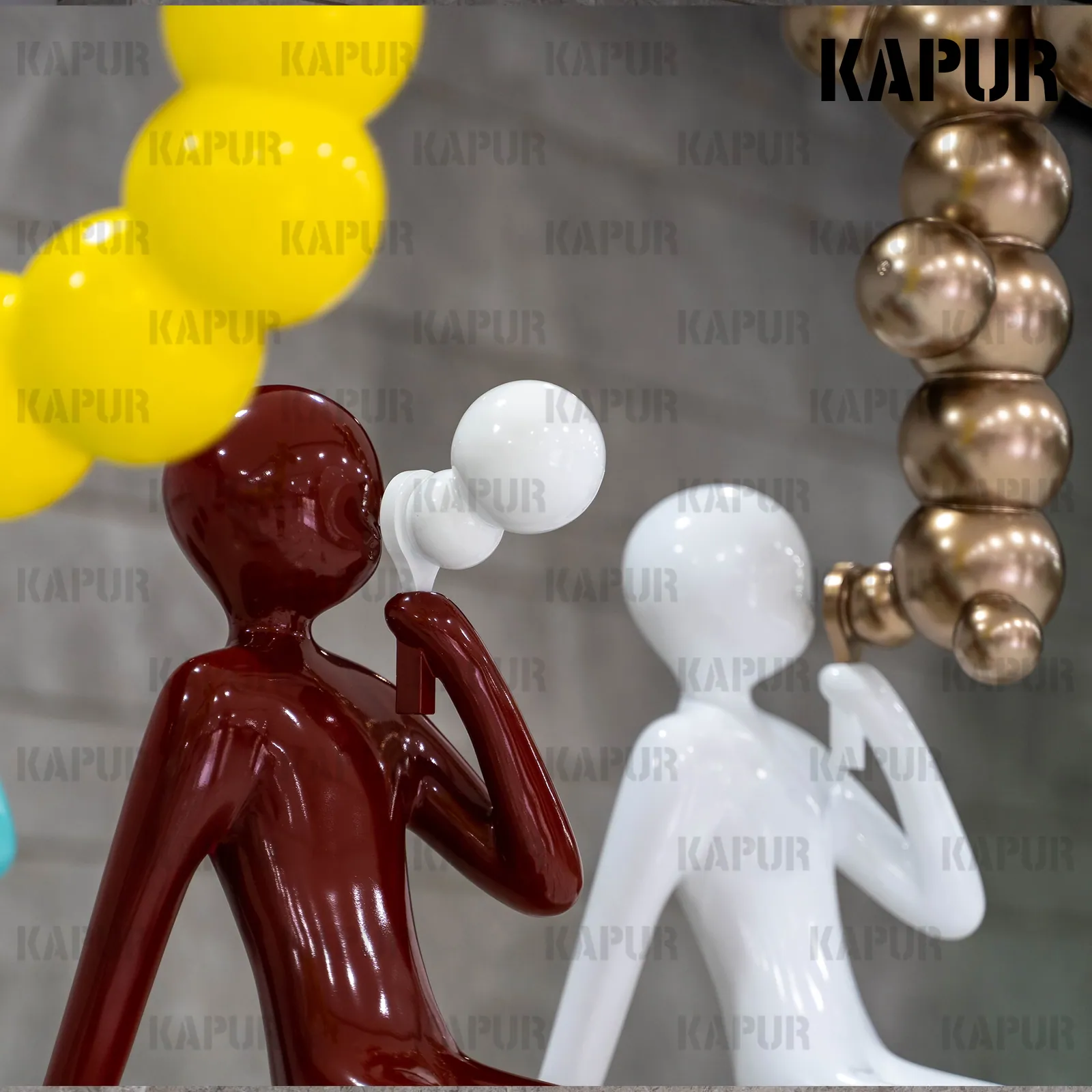 Second view of the fiberglass bubble blowing figure showing the smooth, painted surface and flowing form
