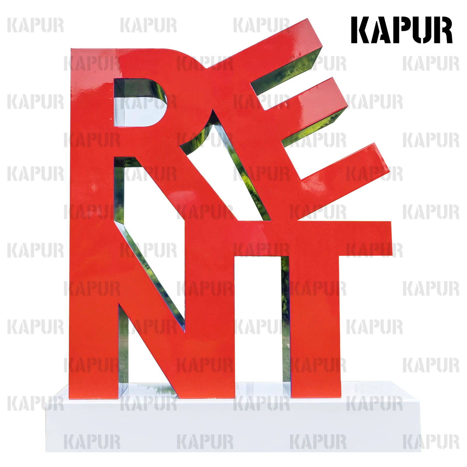 Polished stainless steel letter sculpture spelling a name or slogan, standing on a paved outdoor plaza