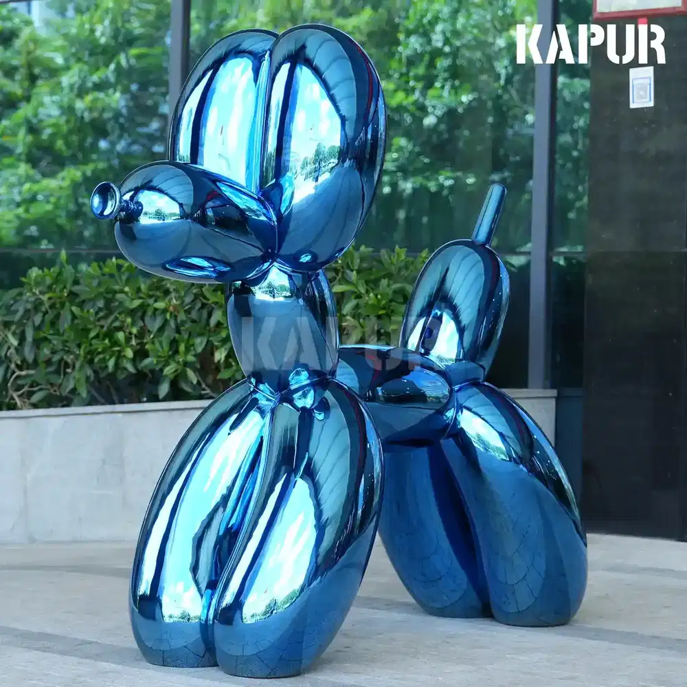 Large stainless steel Balloon Dog sculpture in a polished finish standing in an urban plaza