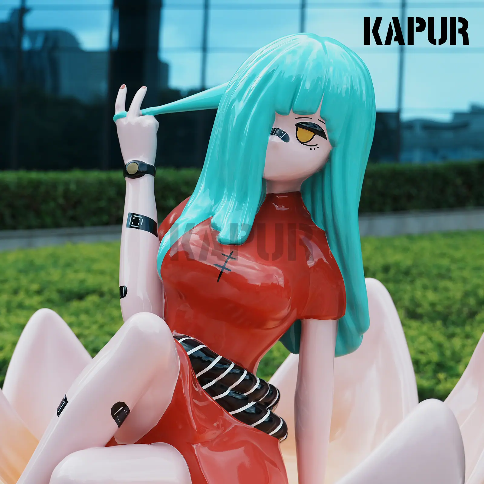 Second view of the fiberglass character sculpture showing the detailed facial features and stylized form