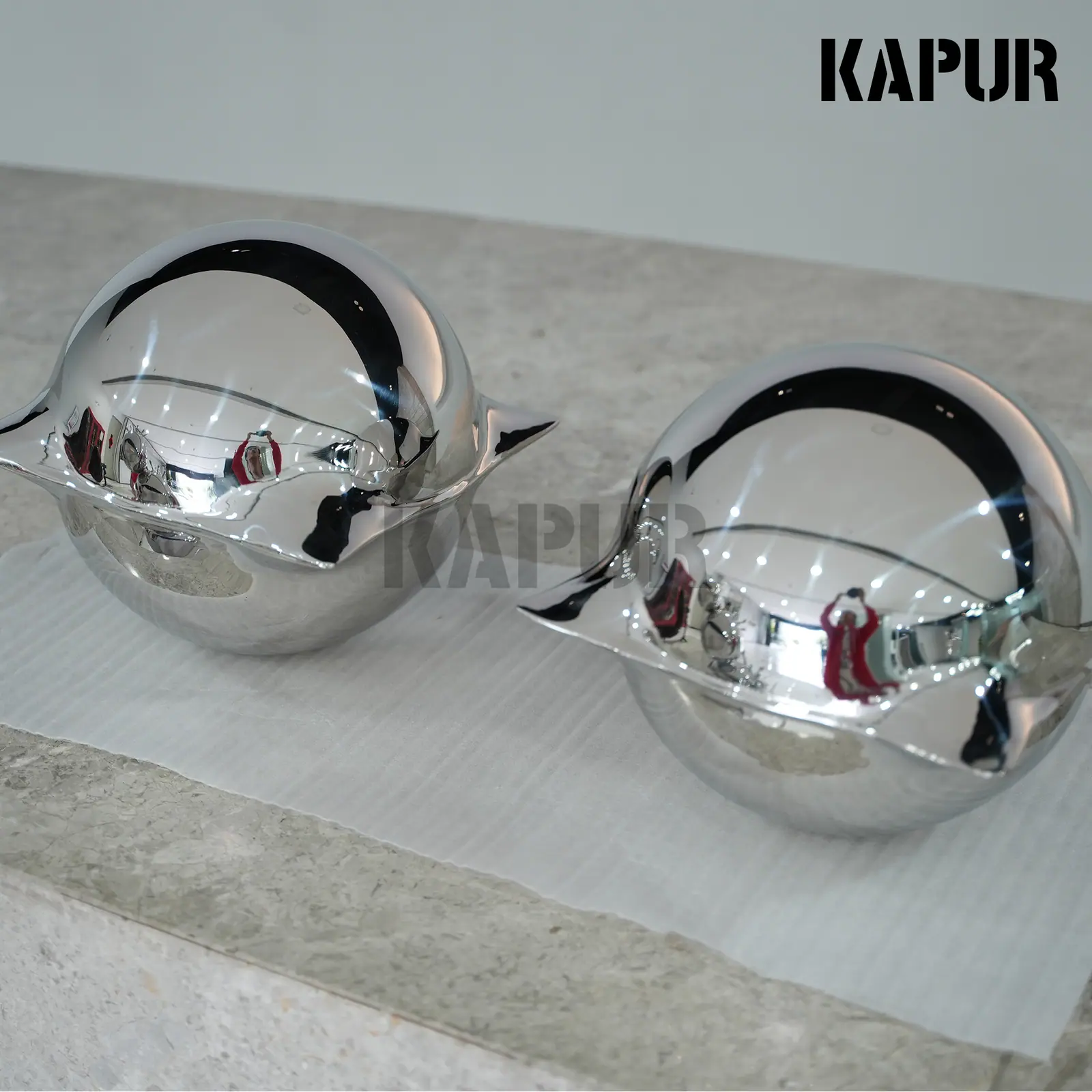 Second view of the stainless steel decorative ball showing the seamless reflective surface and rounded form