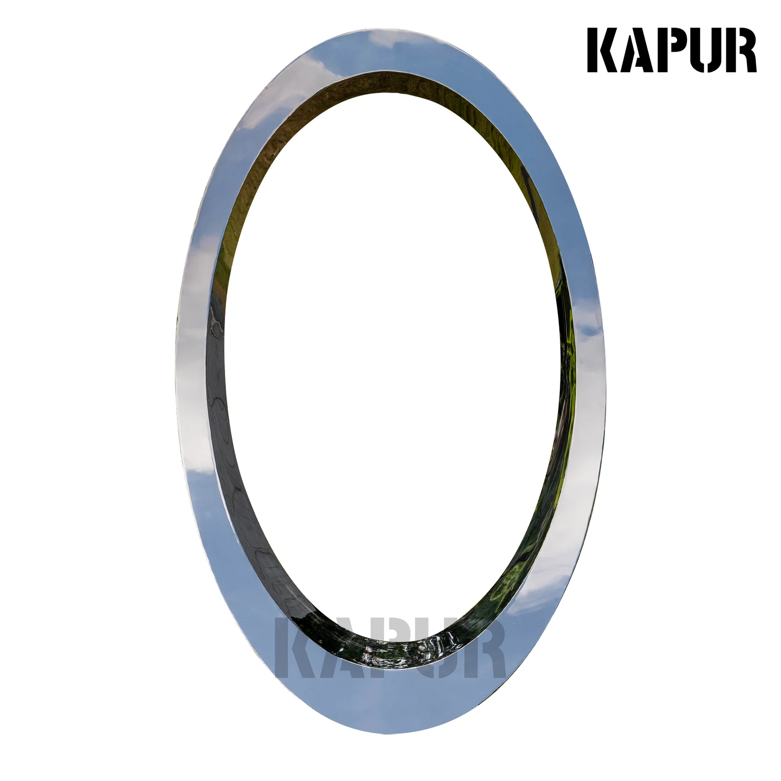 Slant-cut circular stainless steel sculpture standing in a modern garden landscape with reflective surface catching sunlight