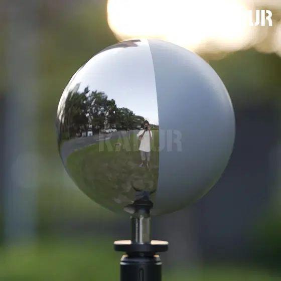 126mm diameter 18% grey mirror ball on a tripod stand, showing reflective surface under studio lighting