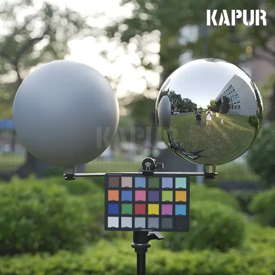 Set of two 250mm VFX balls: one mirror polished, one 50% gray, on a white background