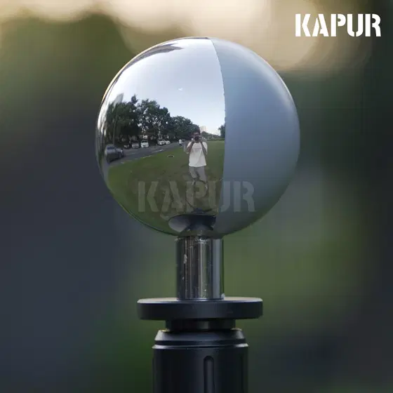 60mm diameter 18% grey visual effects HDRI ball mounted on a tripod in a studio setting