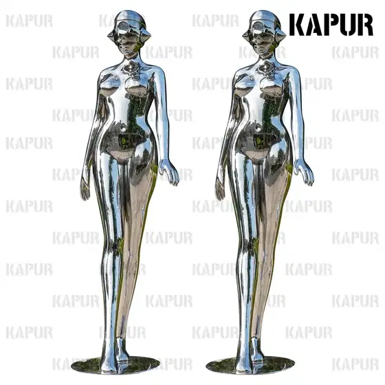 Abstract female figure sculpture in polished stainless steel standing in an outdoor plaza