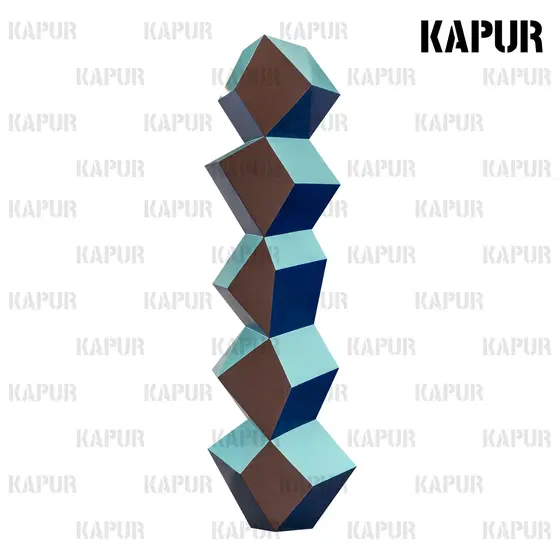 Polished stainless steel rhombus sculpture standing on a paved outdoor plaza with reflective surface catching sunlight