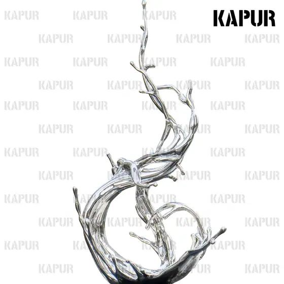Polished stainless steel water flowers sculpture standing on a paved outdoor plaza with reflective surface catching sunlight