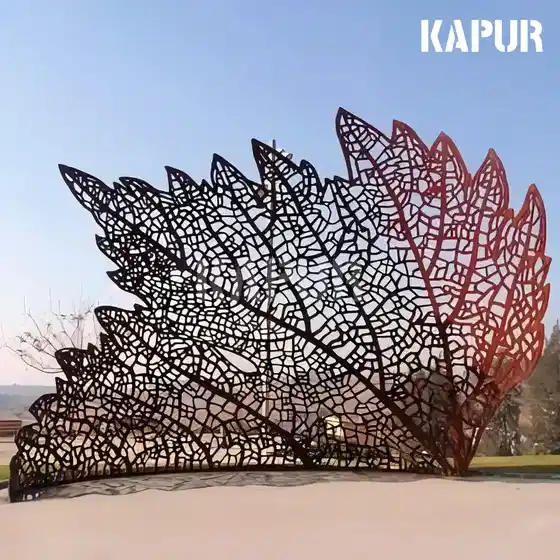 Corten steel leaf skeleton sculpture standing in an outdoor garden with natural light highlighting the rusted surface