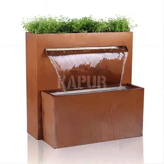 Corten steel waterfall fountain sculpture in an outdoor garden setting with water flowing down textured rusted surfaces