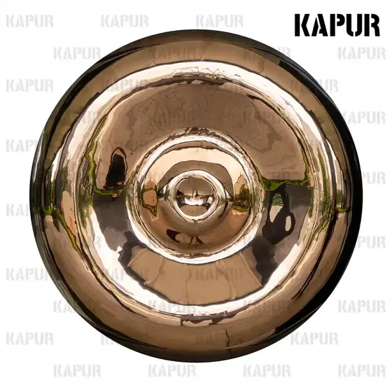 Mirror-polished stainless steel water ripple wall sculpture mounted on a white interior wall, reflecting light and shadow