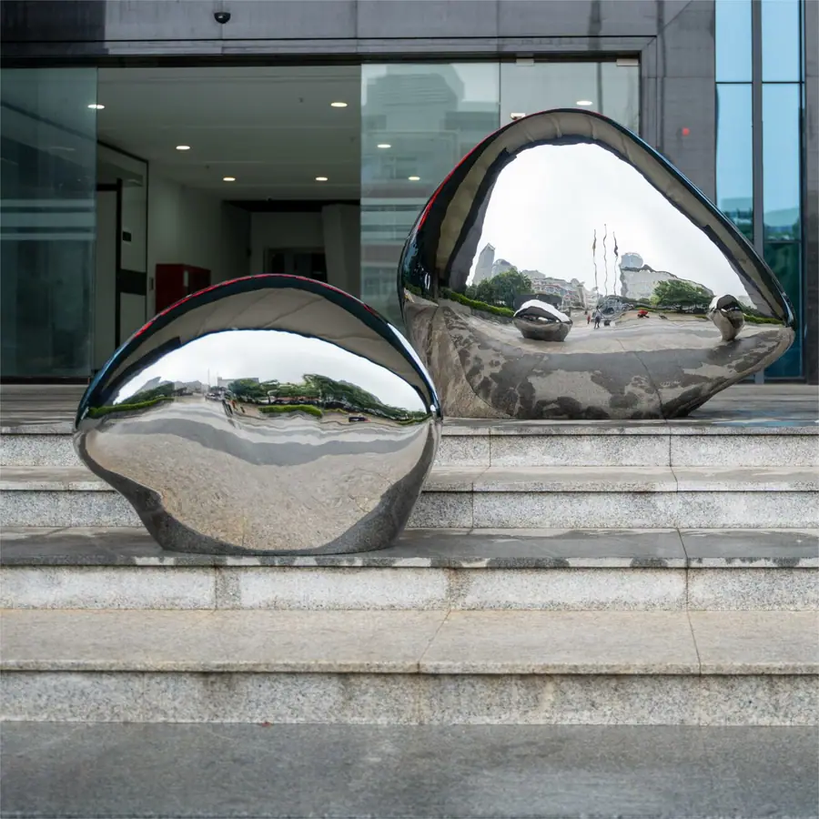 Stainless steel high gloss stone sculpture. From sculptural concept to detailed production, we create unique artworks tailored for each client.