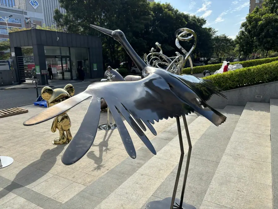 metal crane sculpture