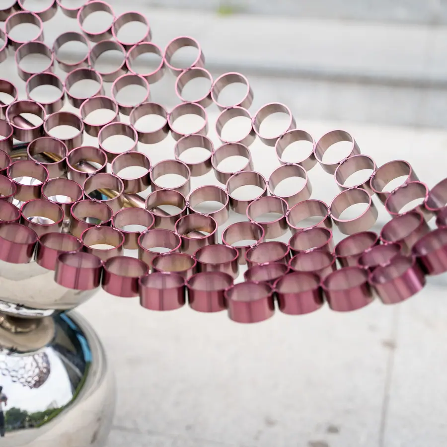 Outdoor abstract sculpture art: the harmonious dance of flowers and balls