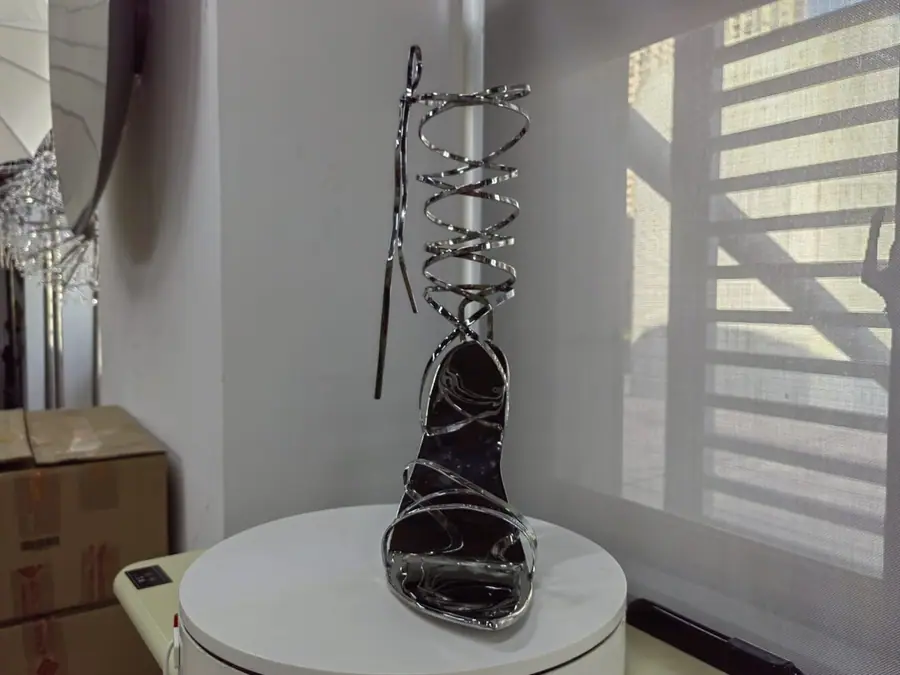 Stainless steel high heel art sculpture