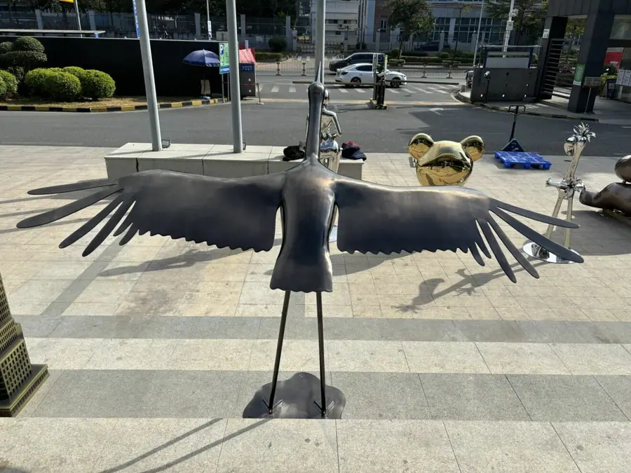 metal crane sculpture