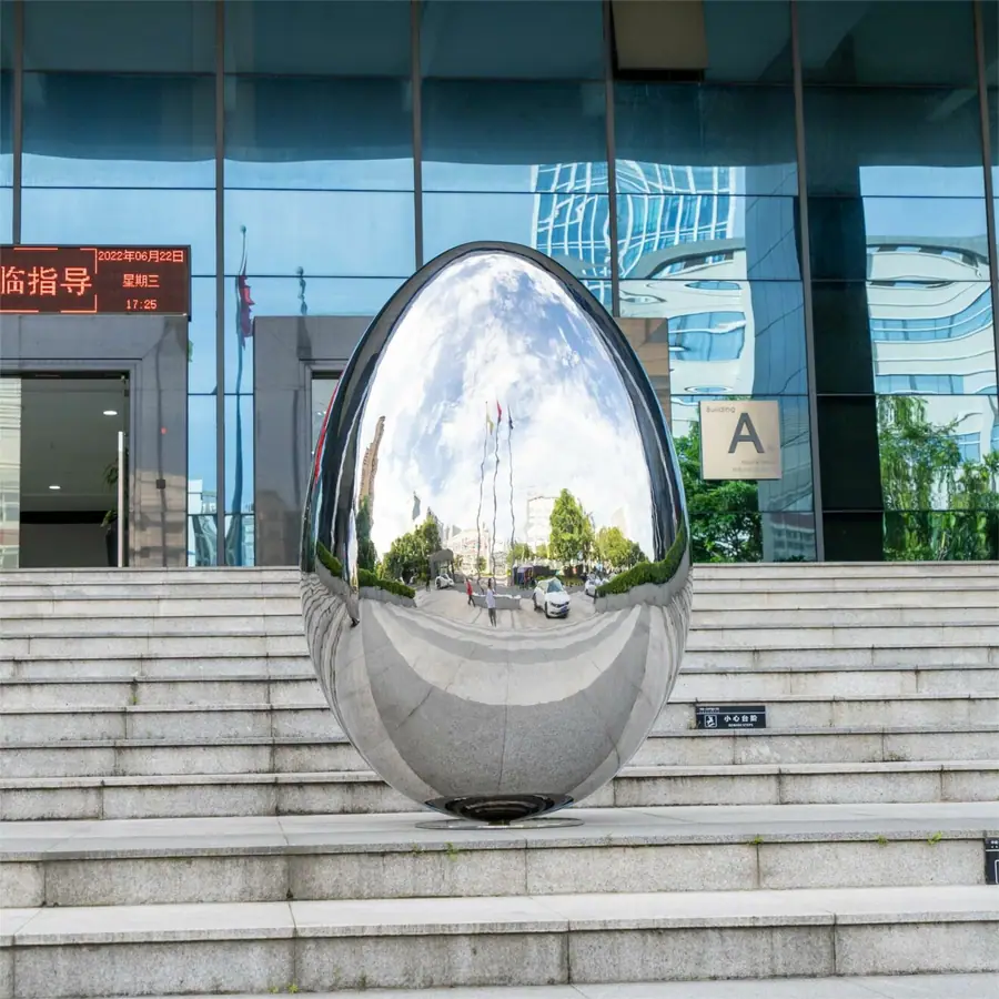 Outdoor stainless steel elliptical spherical sculpture