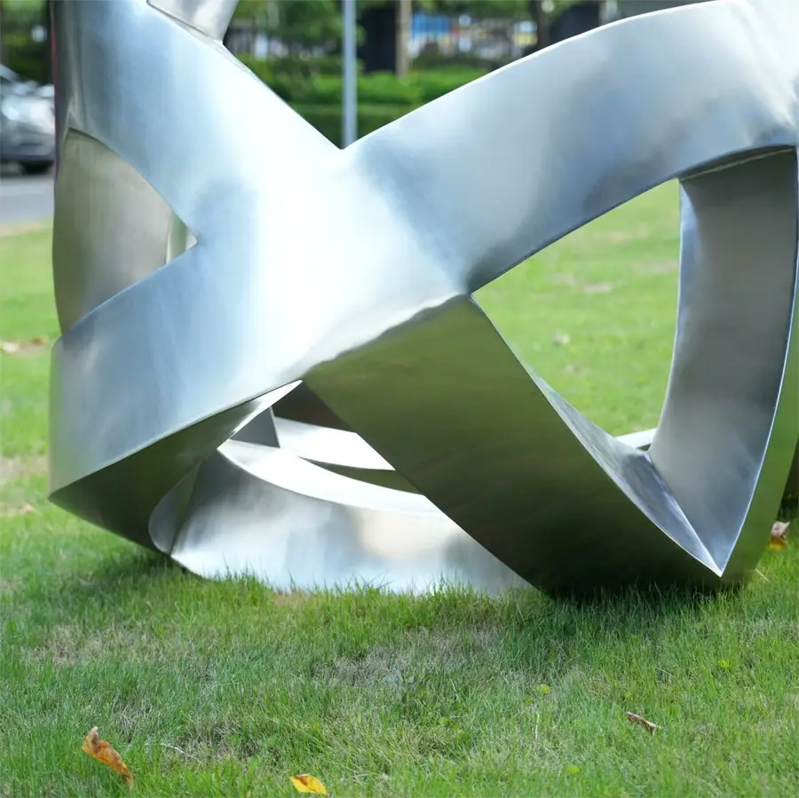 Stainless steel abstract ribbon-wrapped sculpture