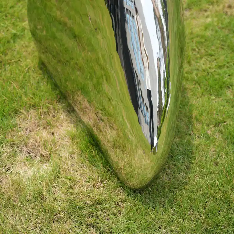 Stainless steel high gloss stone sculpture. From sculptural concept to detailed production, we create unique artworks tailored for each client.