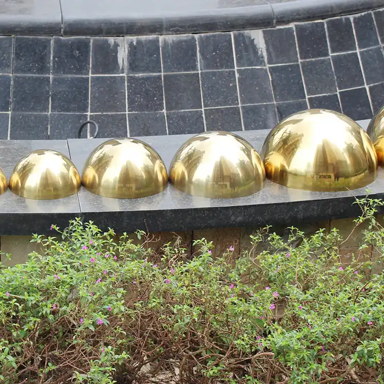 Analyze the production process and challenges of stainless steel sphere sculptures