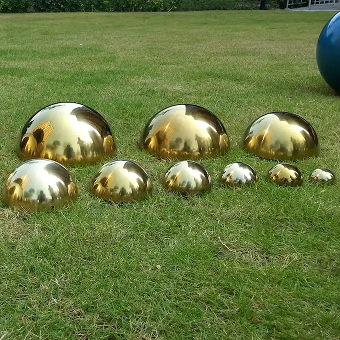 Analyze the production process and challenges of stainless steel sphere sculptures