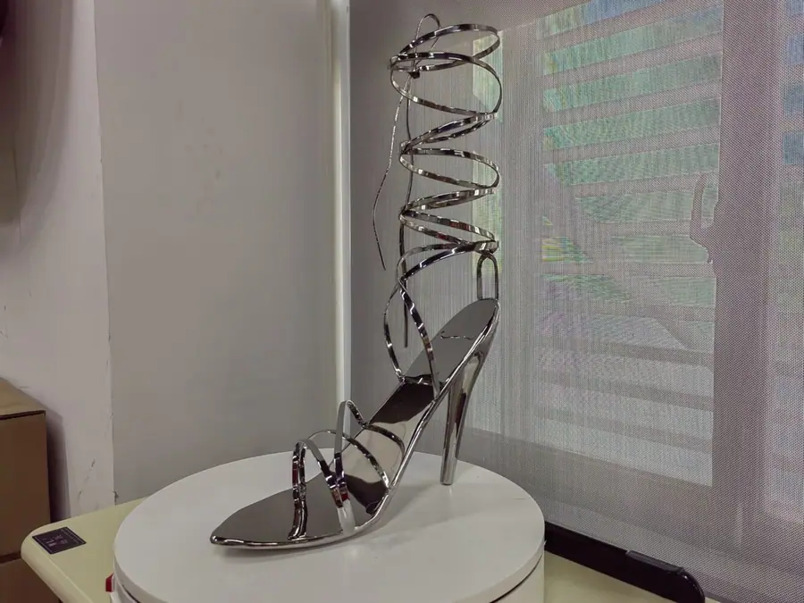Stainless steel high heel art sculpture