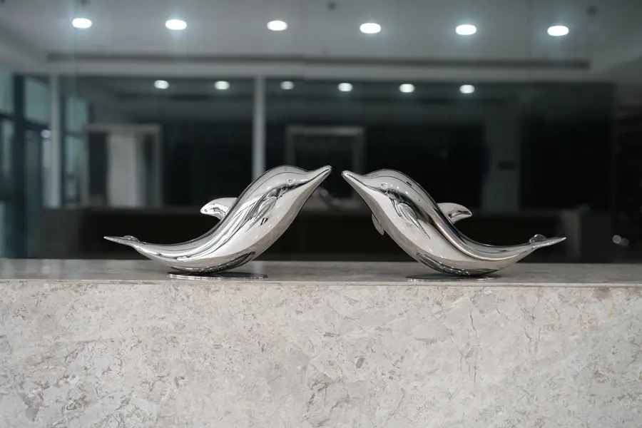 stainless steel dolphin sculpture