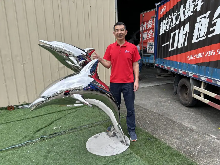The Enchanting Beauty of Metal Dolphin Sculptures