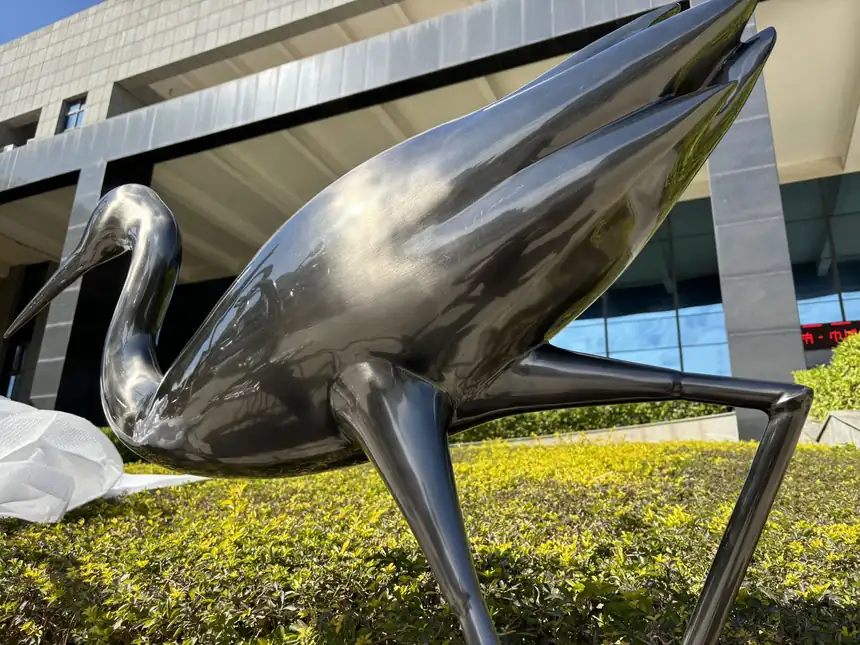 metal crane sculpture
